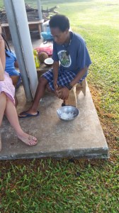 Amelia scraping a coconut