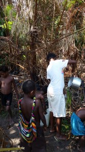 Evelyn and the kids getting water